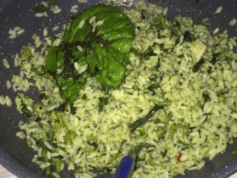 Rice with broccoli, pesto, toasted almonds and parmesan